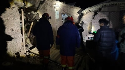 Firefighters inspect an earthquake-hit village houses in Baqen County of Nagqu City in Tibet, on Friday. (AP) Firefighters inspect an earthquake-hit village houses in Baqen County of Nagqu City in Tibet, on Friday. (AP)