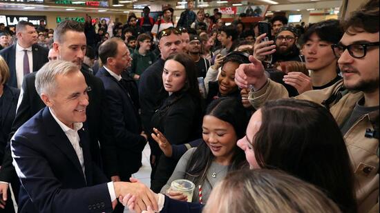 Canadian Prime Minister Mark Carney greets students during a visit to the University of Calgary, on October 15. (REUTERS)