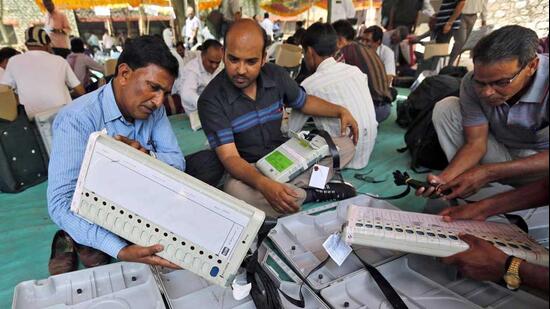 Election staff check electronic voting machines (EVM) at a distribution centre ahead of the fifth phase of general election at Sirohi district in Rajasthan. (Reuters)