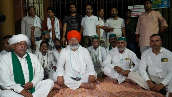 Bharatiya Kisan Union (BKU) leader Rakesh Tikait sits on a dharna in protest against the closure of gates at the Ganna Sansthan premises on the eve of his proposed 'Kisan-Mazdoor Mahapanchayat' (PTI Photo/Nand Kumar)