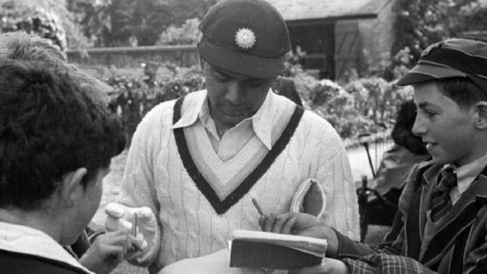 BB Nimbalkar signing autographs.