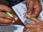 Voters queue outside a polling booth as voting begins for panch and sarpanch posts in 3,314 gram panchayats across Rajasthan.(HT Photo/File)