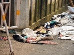 Footwear and other items lie scattered at the site after a stampede  at Chor Bagan Durga Puja Pandal.