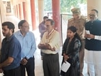 Deputy CM Brajesh Pathak standing in queue at Hewett Polytechnic in Lucknow to cast his vote in the UP MLC polls on Friday. (HT)