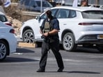 A member of Israeli forces guards the area on the day Israeli Prime Minister Benjamin Netanyahu visits the site following a shooting in Hebron. 