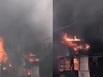 According to initial reports, the fire spread to nearby food outlets, with thick smoke billowing from the site.