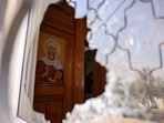 A shattered window at Saint George’s Greek Orthodox Church, where gunmen opened fire during a funeral the previous day, in the village of Hamoud, Karak, Jordan.