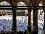 People and pilgrims walk at the Grand Mosque Complex in Saudi Arabia's holy city of Mecca.