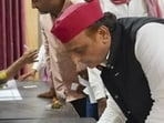 SP chief Akhilesh Yadav casts his vote for the UP Legislative Council (MLC) Graduate and Teacher constituency elections, at Saifai, in Etawah district, Friday. (PTI Photo)