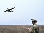 A serviceman of the National Police Special Purpose Battalion Zaporizhzhia region controls a reconnaissance and strike drone while they work at a position near a front line, in Donetsk region.