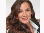 Douglas Elliman fired Helen Tzelios over alleged racial discrimination against a couple who were house-hunting. 