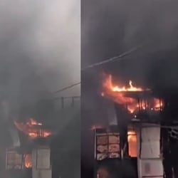 According to initial reports, the fire spread to nearby food outlets, with thick smoke billowing from the site.