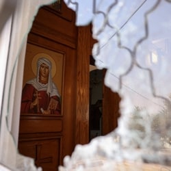A shattered window at Saint George’s Greek Orthodox Church, where gunmen opened fire during a funeral the previous day, in the village of Hamoud, Karak, Jordan.