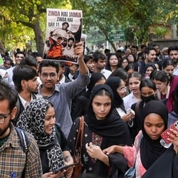 Students of Jamia Millia Islamia Law Department take out a peaceful 'black coat' march amid heightened security, in New Delhi, Thursday, Oct. 22, 2026. 