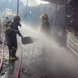 Firefighters carried out dousing operations after a major fire broke out at temporary food shops in Raipur village, Noida, on Saturday.