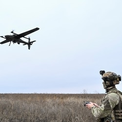 A serviceman of the National Police Special Purpose Battalion Zaporizhzhia region controls a reconnaissance and strike drone while they work at a position near a front line, in Donetsk region.