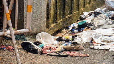 Footwear and other items lie scattered at the site after a stampede at Chor Bagan Durga Puja Pandal. (ANI) Footwear and other items lie scattered at the site after a stampede at Chor Bagan Durga Puja Pandal. (ANI)