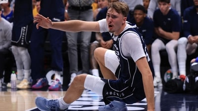 Cooper Flagg injured his left shoulder after taking a hard foul and hitting the floor during the game. (Getty Images via AFP)