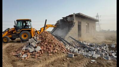 During the drive, enforcement teams demolished boundary walls, plinth-level structures, private offices, sewer lines and earthen road networks across these unauthorised colonies. (HT) During the drive, enforcement teams demolished boundary walls, plinth-level structures, private offices, sewer lines and earthen road networks across these unauthorised colonies. (HT)