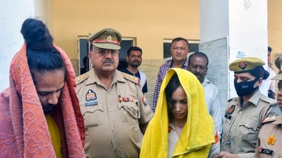 Police take away Merchant Navy officer Saurabh Rajput's wife Muskan and her lover Sahil Shukla after they were arrested in connection with his murder. (PTI)