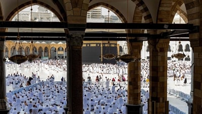 People and pilgrims walk at the Grand Mosque Complex in Saudi Arabia's holy city of Mecca. (AFP)