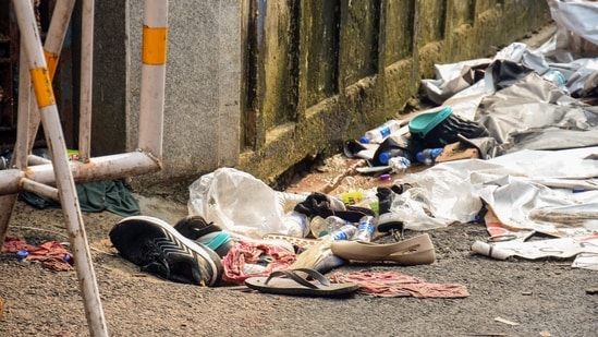 Footwear and other items lie scattered at the site after a stampede  at Chor Bagan Durga Puja Pandal.