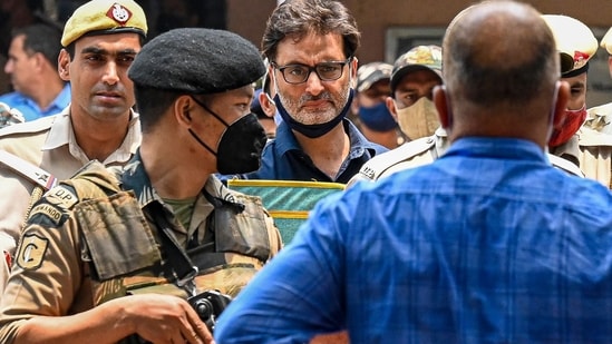 File photo of police and security personnel escorting Jammu Kashmir Liberation Front chairman Yasin Malik (C) to a court. (AFP)