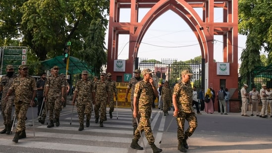 Security personnel keep vigil as students of Jamia Millia Islamia amid the ongoing protests at the university. (PTI)