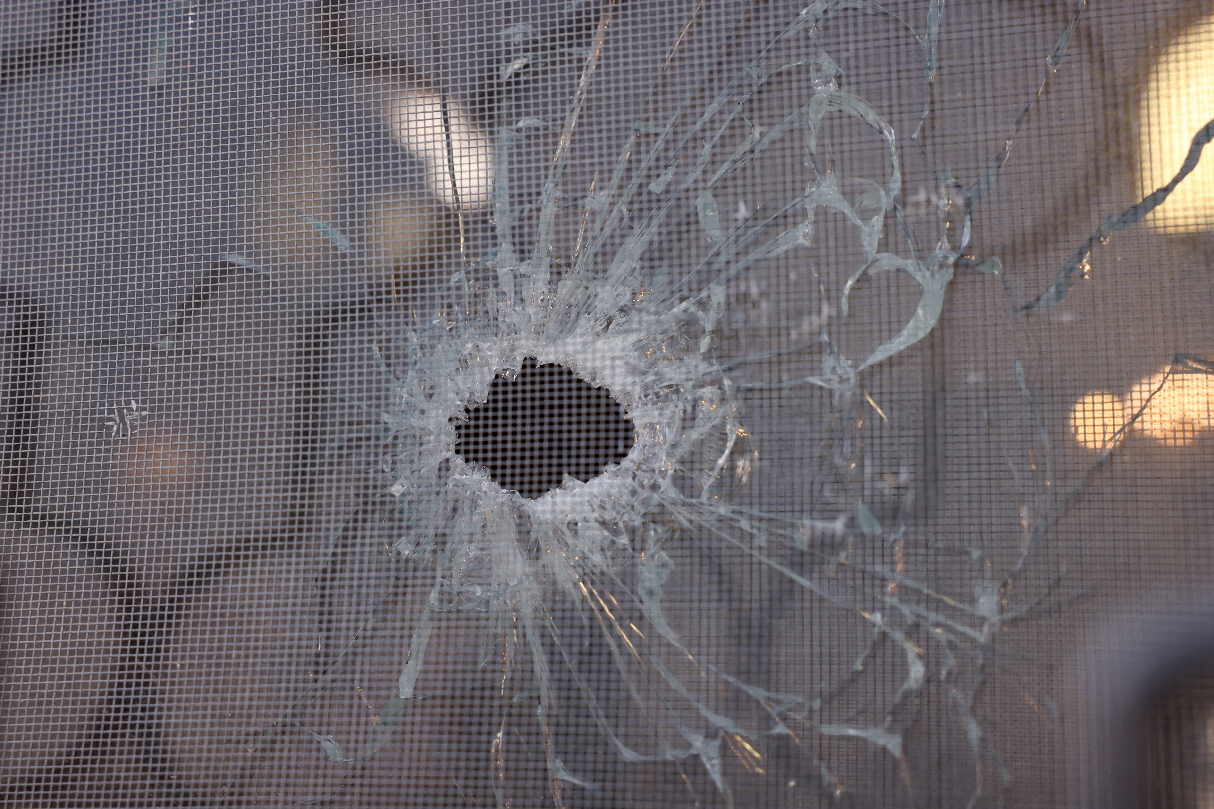 A window with a bullet hole at Saint George’s Greek Orthodox Church, where gunmen opened fire during a funeral the previous day, in the village of Hamoud, Karak, Jordan, October 24, 2026. REUTERS/Alaa Al Sukhni (REUTERS)