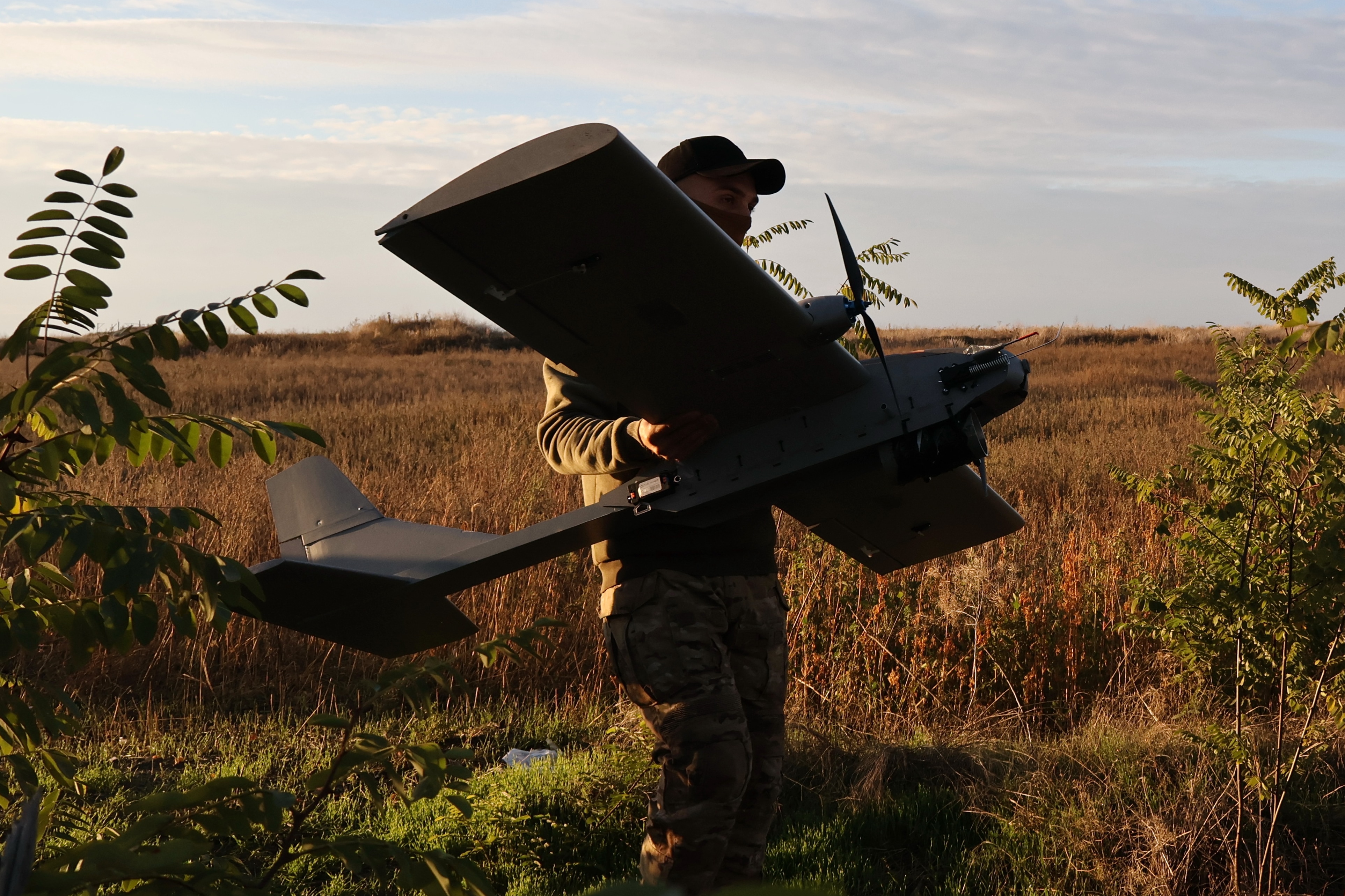A Ukrainian serviceman launches a drone towards Russian positions at the front line in Zaporizhzhia. (Ukrainian 65 Mechanized brigade via AP)