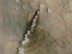 A satellite image shows smoke rising from the Saudi Aramco distribution centre, after what the Saudi-led coalition in Yemen said were attacks by Yemen's Iran-aligned Houthis, in Abha Bulk, Saudi Arabia,