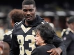 New Orleans Saints tight end Juwan Johnson hugs owner Gayle Benson before an NFL preseason football game between the New Orleans Saints and the Jacksonville Jaguars Saturday, Aug. 15.