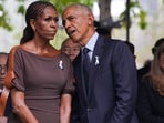 (L/R) Former First Lady Michelle Obama and former US President Barack Obama attend the 25th anniversary commemoration of the September 11, 2001 attacks at the National September 11 Memorial in New York on September 11, 2026. (Photo by Hiroko MASUIKE / POOL / AFP)