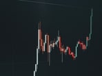 Wall Street investors watch Big Tech earnings and the Federal Reserve's interest rate decision as US stocks face a crucial week.(Unsplash)