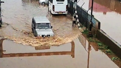 A car wades through a waterlogged street following heavy rainfall near the Ooty bus stand, in Nilgiris on Saturday. (ANI Video Grab) (ANI Video Grab) A car wades through a waterlogged street following heavy rainfall near the Ooty bus stand, in Nilgiris on Saturday. (ANI Video Grab) (ANI Video Grab)