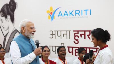 Prime Minister Narendra Modi during an interaction with women workers in Varanasi on Sunday. (PTI PHOTO)