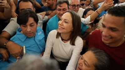 Venezuelan opposition leader Maria Corina Machado arrives at a church after returning to the country following nearly a year abroad. (via REUTERS)