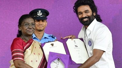President Droupadi Murmu honours actor Dhanush with a Special Mention (Actor) for the film 'Captain Miller' at the 72nd National Film Awards ceremony, in Kevadia. ( @PIBAhmedabad)
