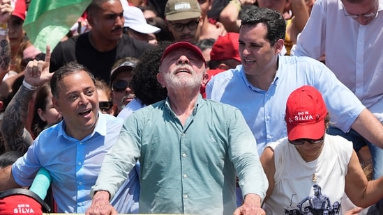 Lula, Bolsonaro’s son face off as Brazil votes in tight presidential race