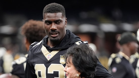 New Orleans Saints tight end Juwan Johnson hugs owner Gayle Benson before an NFL preseason football game between the New Orleans Saints and the Jacksonville Jaguars Saturday, Aug. 15.