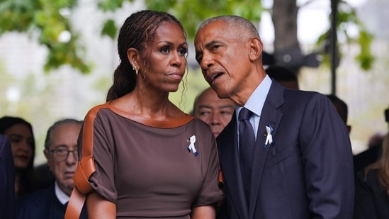 (L/R) Former First Lady Michelle Obama and former US President Barack Obama attend the 25th anniversary commemoration of the September 11, 2001 attacks at the National September 11 Memorial in New York on September 11, 2026. (Photo by Hiroko MASUIKE / POOL / AFP) (AFP)