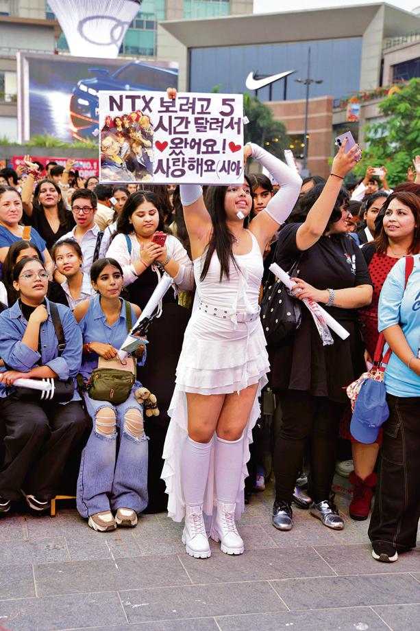 Sia, an NTX fan, caught the group’s attention on stage with her placard Sia, an NTX fan, caught the group’s attention on stage with her placard