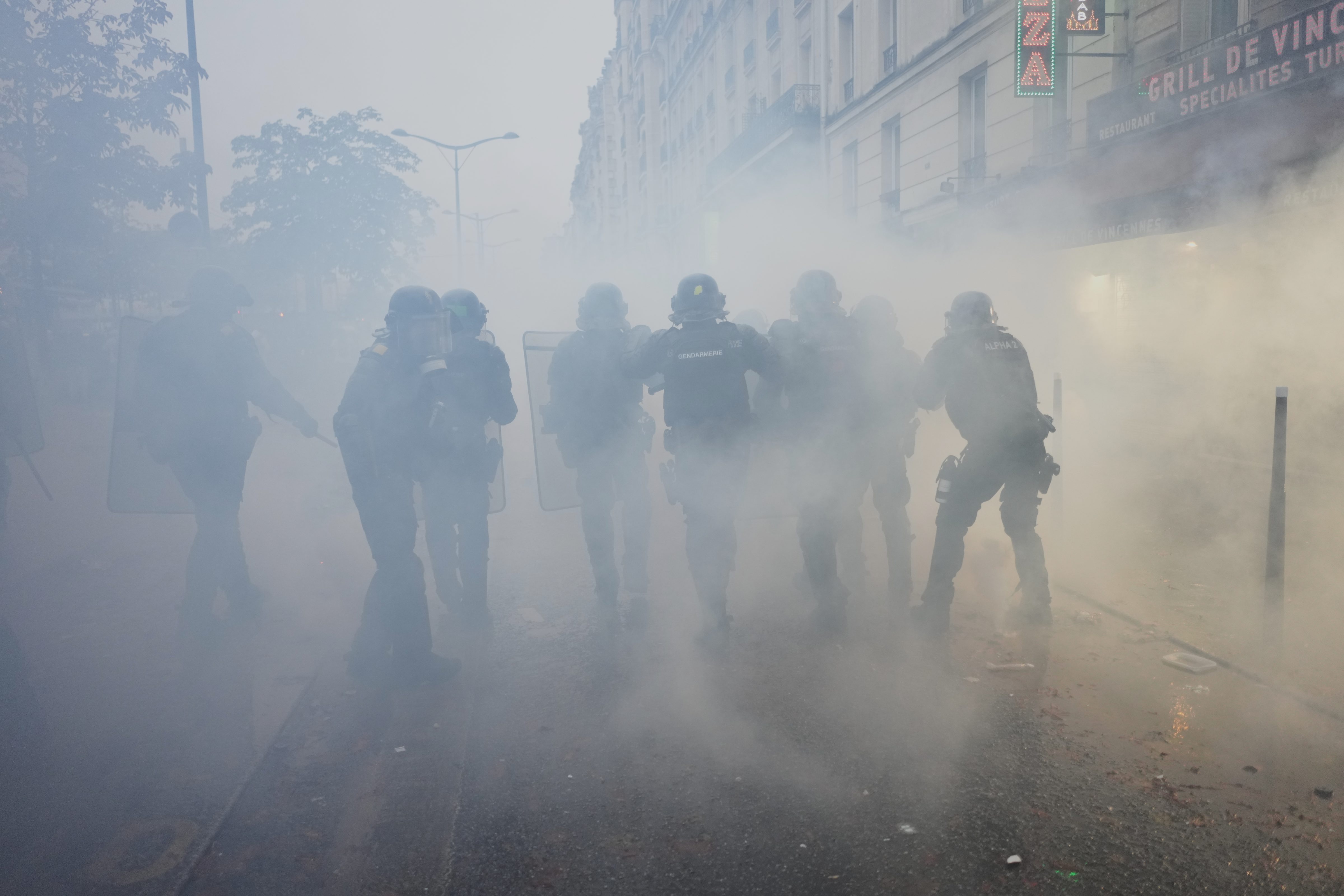 Police officers run toward protesters during a demonstration against rising living costs in Paris, Saturday, Oct. 24, 2026. (AP) Police officers run toward protesters during a demonstration against rising living costs in Paris, Saturday, Oct. 24, 2026. (AP)