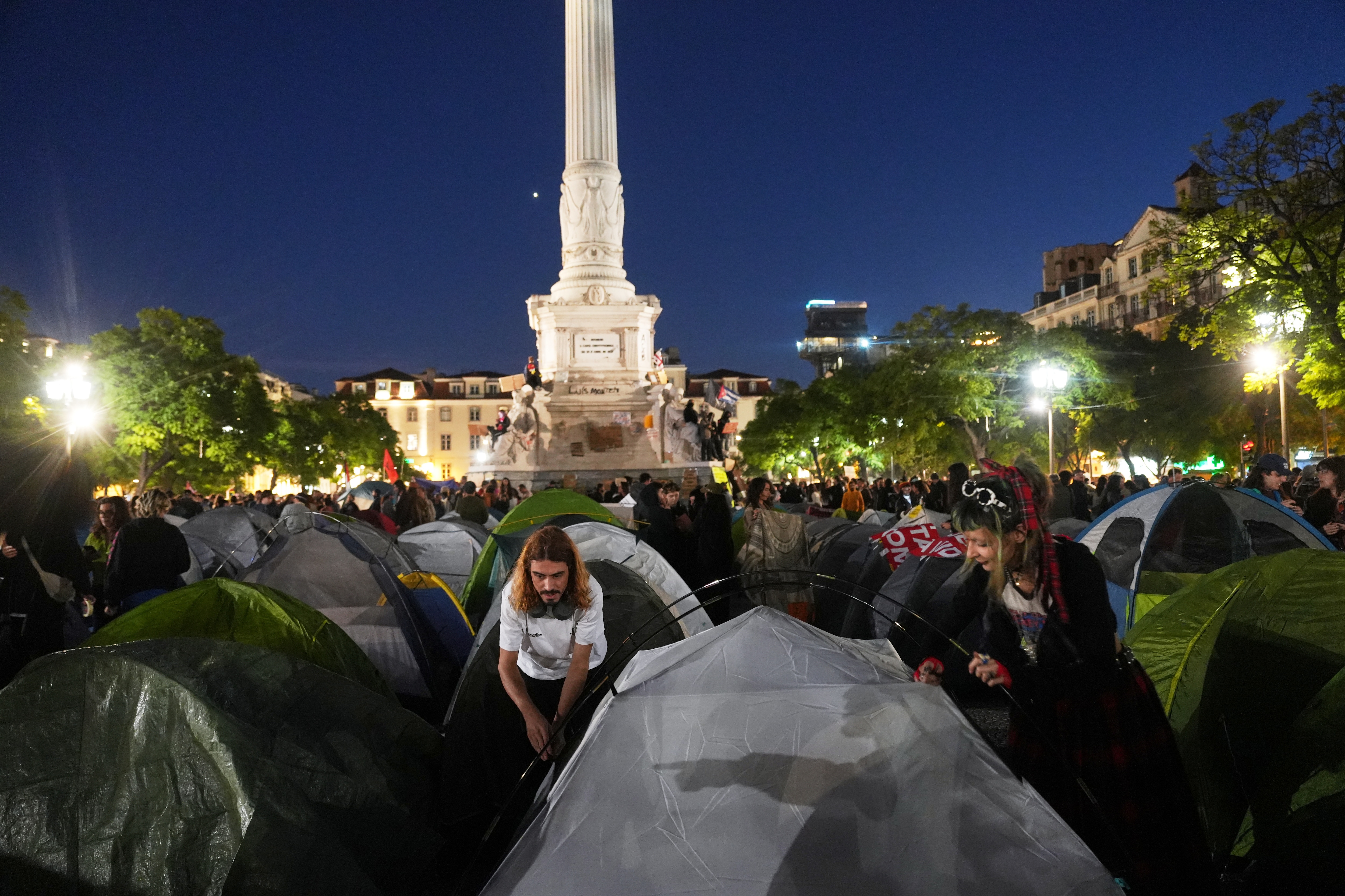 Protestors set up tents to spend the night after a demonstration to demand affordable housing in downtown Lisbon. (AP Photo/Ana Brigida) Protestors set up tents to spend the night after a demonstration to demand affordable housing in downtown Lisbon. (AP Photo/Ana Brigida)