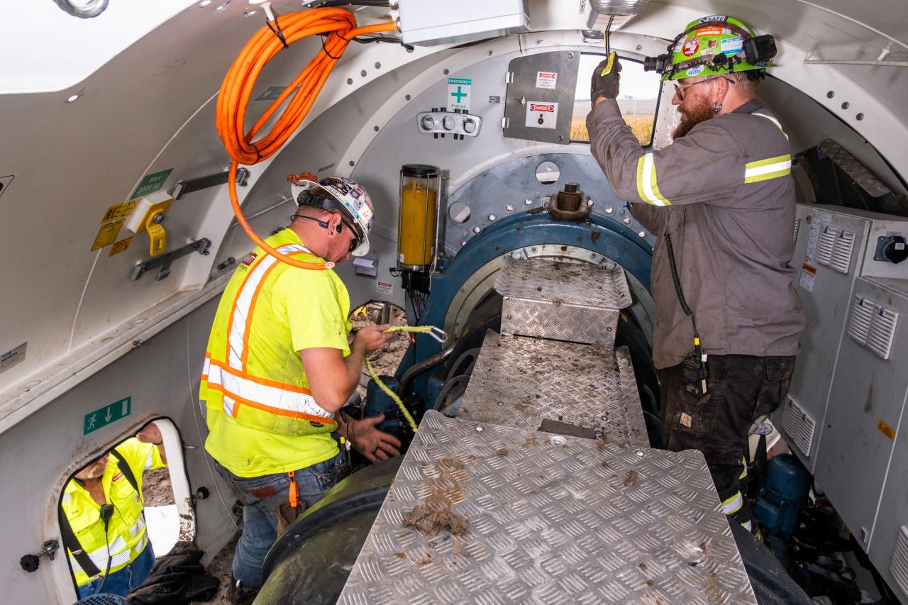 Workers strip copper wiring inside the nacelle for recycling. Workers strip copper wiring inside the nacelle for recycling.