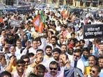 BJP workers protesting against the Congress president’s remarks against the PM in Lucknow on October 26. (HT photo)