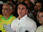Flavio Bolsonaro reacts after knowing the first results in the presidential runoff election, in Brasilia.