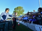 India's Ishan Kishan (L) signs autographs. India's Ishan Kishan (L) signs autographs.
