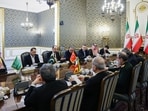  Ibrahim Kalin, the head of Turkey's intelligence service, rear third left, speaks in a meeting of high-level delegations from Saudi Arabia, Pakistan and Turkey with Iranian President Masoud Pezeshkian, front second left, and other top Iranian officials in Tehran, Iran, Monday, Oct. 26, 2026