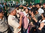 Students of Jamia Millia Islamia stage a protest demanding entry to their campus amid an ongoing strike, as security personnel allow only hostel residents to enter the campus in New Delhi. Students of Jamia Millia Islamia stage a protest demanding entry to their campus amid an ongoing strike, as security personnel allow only hostel residents to enter the campus in New Delhi.